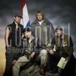 04-02-2002 Adam Curry, Michiel Veenstra, Alexander Stevens and Arend Langenberg at studio in Amsterdam, by order of Veronica Magazine. On behalf of Mission Iraq, February 04, 2002.

[keywords]Posed, Military Clothes, Flag[/keywords]